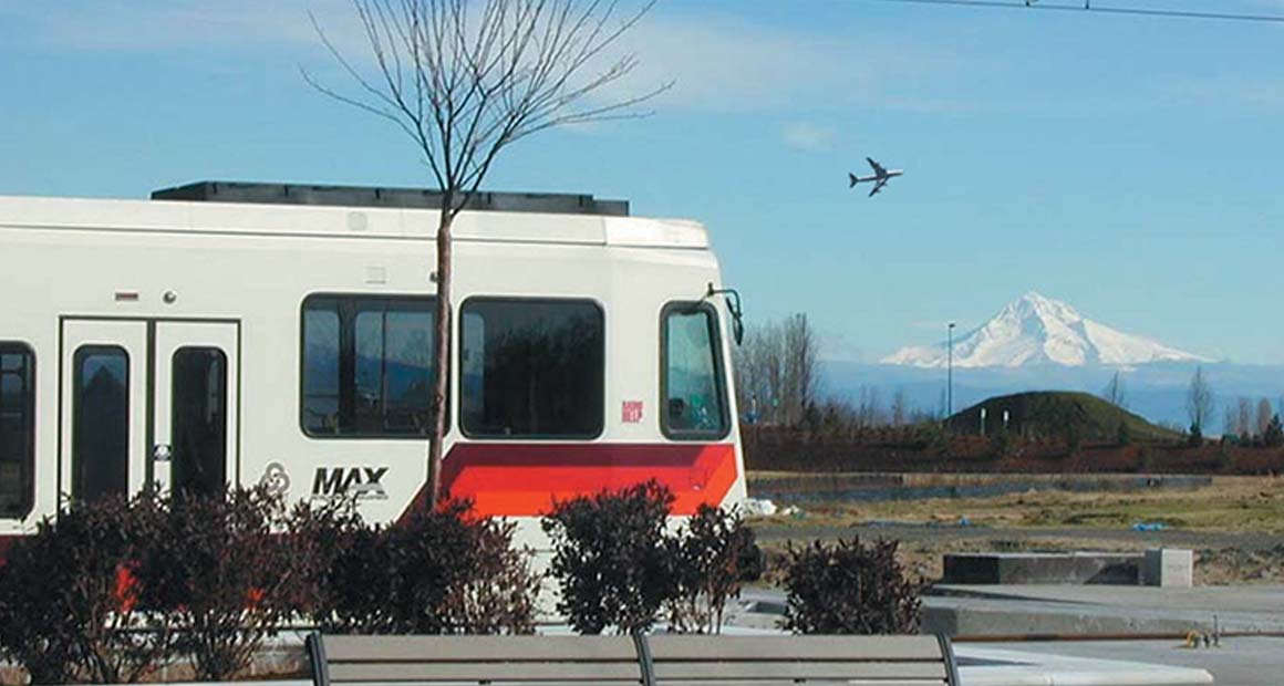 MAX with an airplane in the background